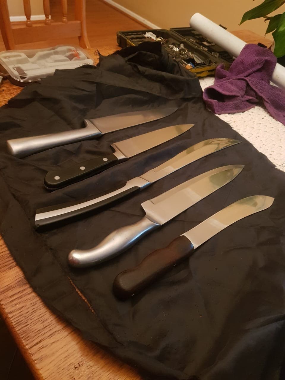 Restored ApexEdge knives on a workbench
